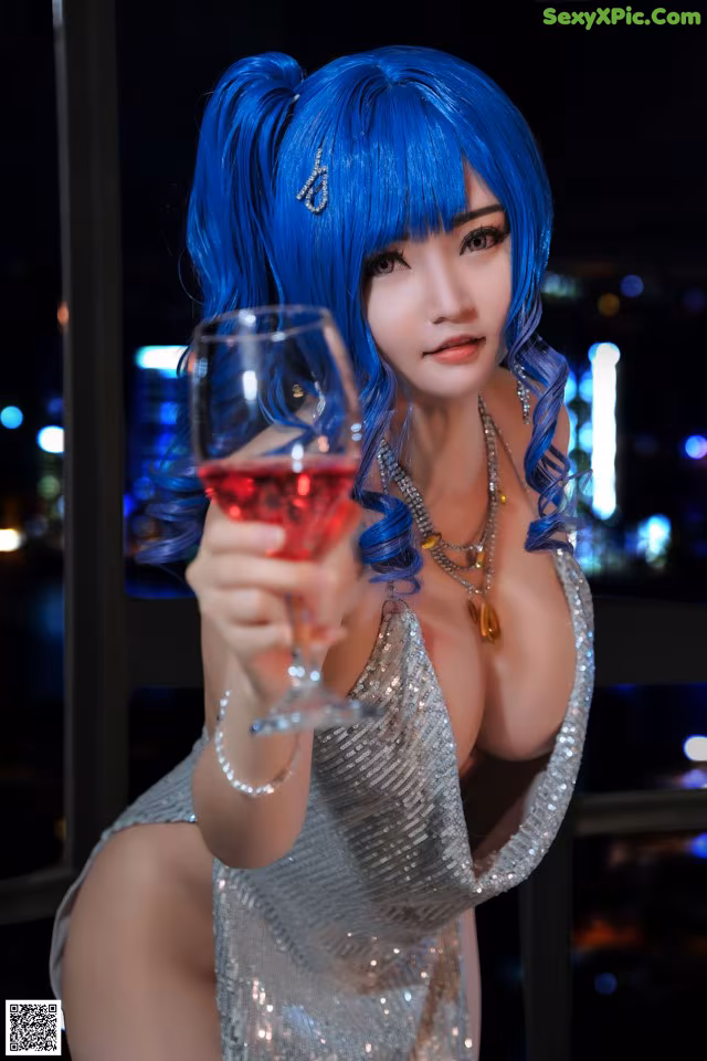 A woman with blue hair holding a glass of wine.