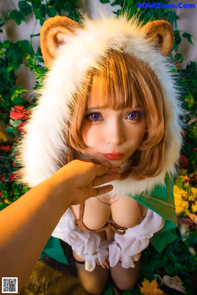 A woman in a bear costume is posing for a picture.